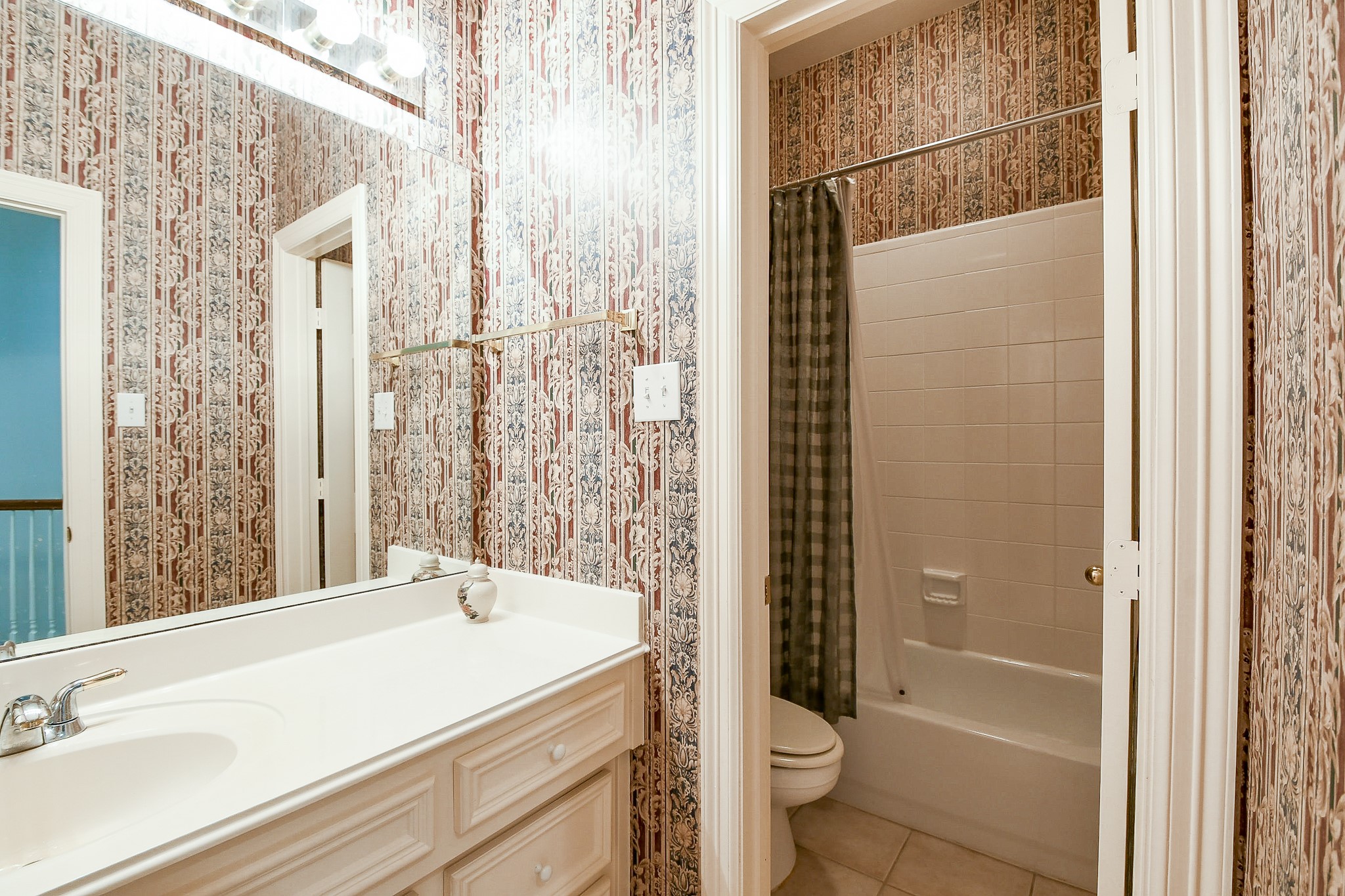 3003 Grand Noble Circle Houston, TX 77068 - Photo 27 of 32 a bathroom with a sink and a mirror
