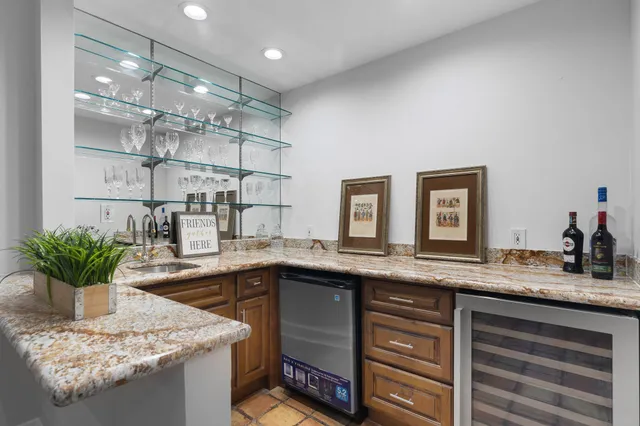 a kitchen with a sink and a potted plant