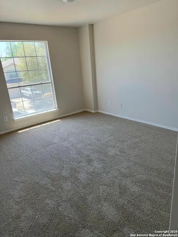 an empty room with a fireplace