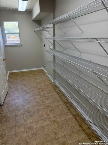 a view of a room with racks on the wall