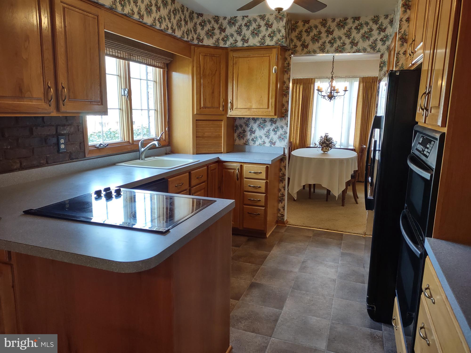 601 Rowe Drive Aberdeen, MD 21001 - Photo 15 of 52 a kitchen with stainless steel appliances granite countertop a sink a stove and a refrigerator