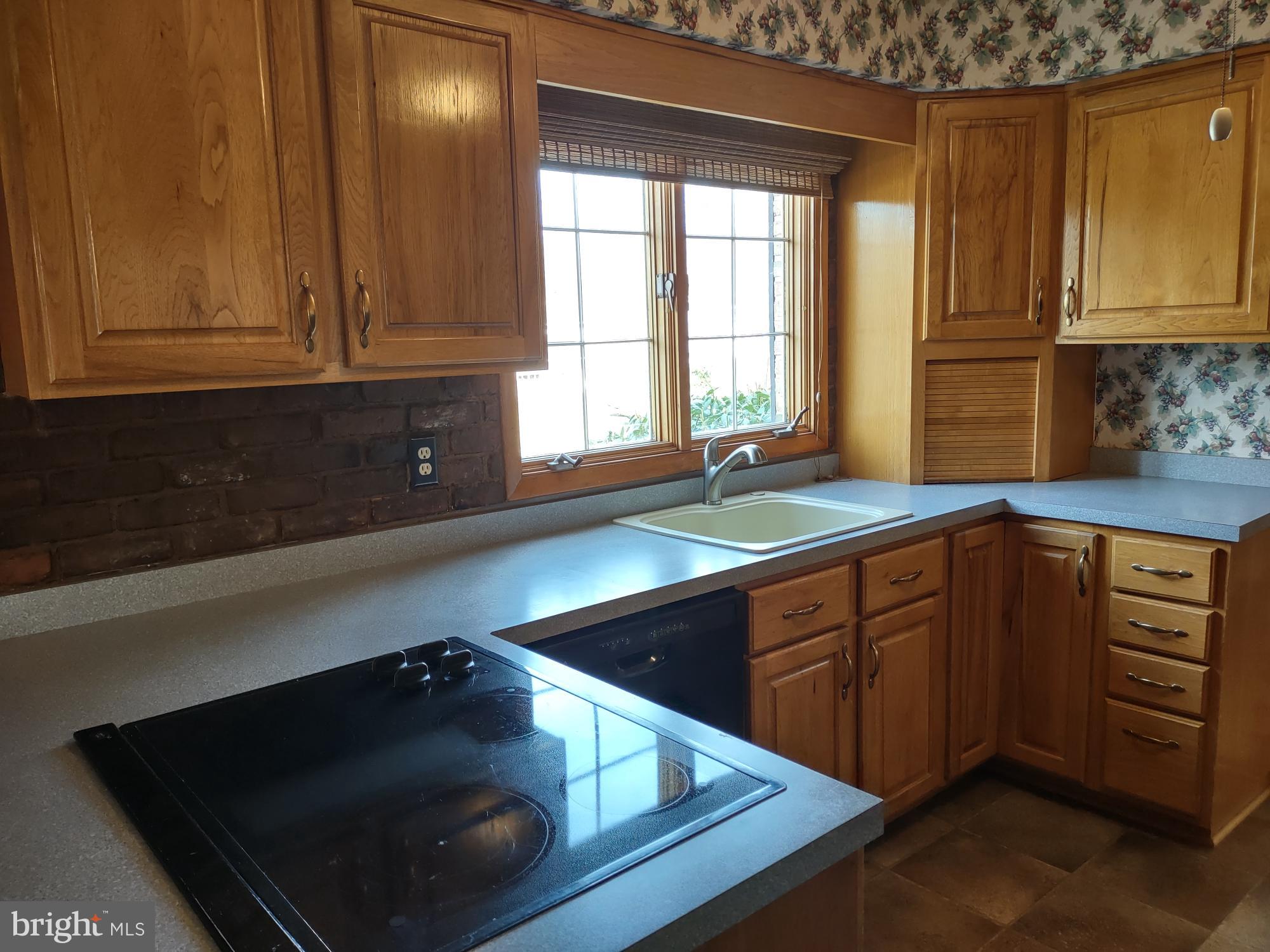 601 Rowe Drive Aberdeen, MD 21001 - Photo 18 of 52 a kitchen with wooden cabinets and a sink