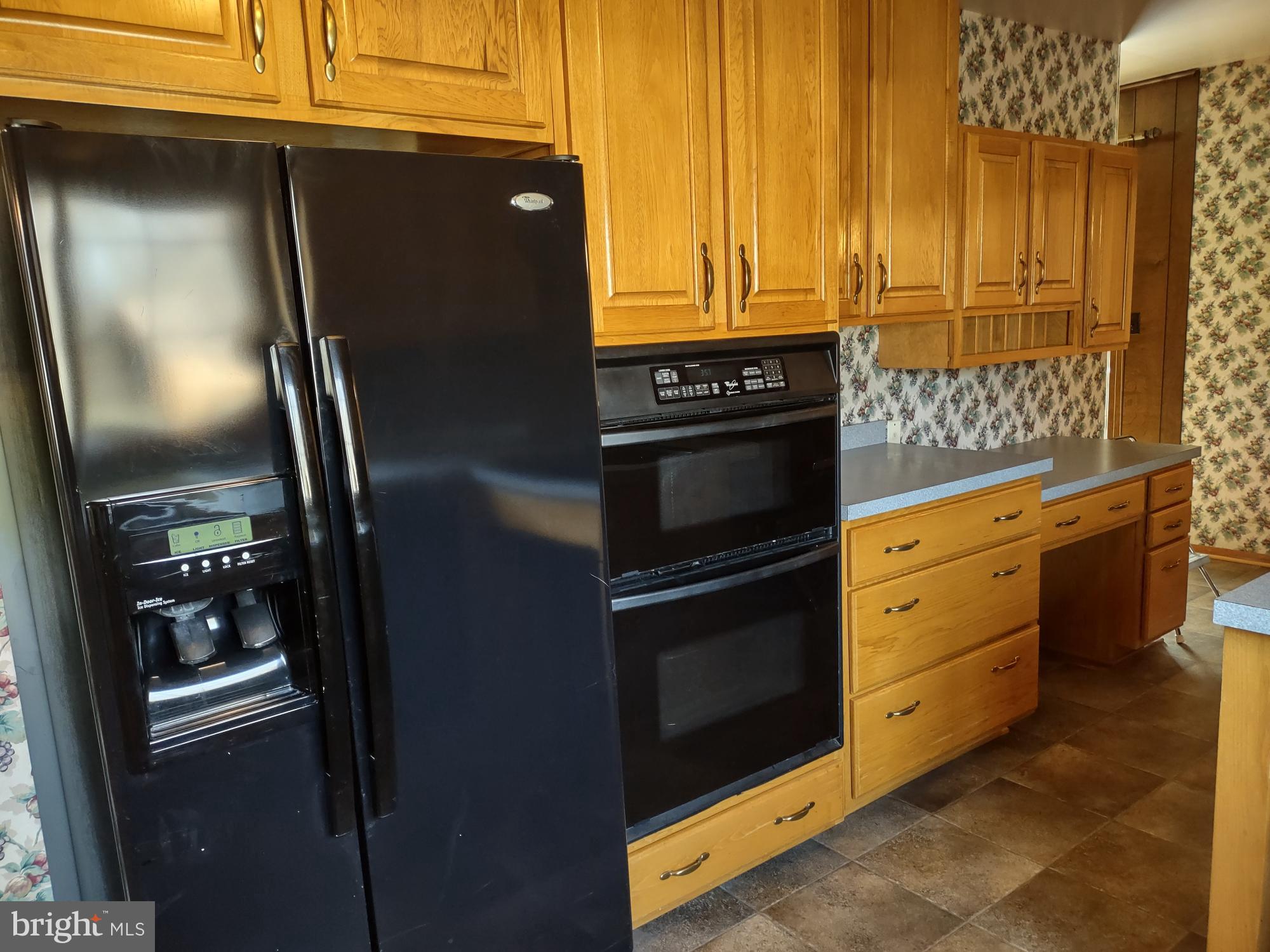 601 Rowe Drive Aberdeen, MD 21001 - Photo 19 of 52 a kitchen with granite countertop white cabinets and stainless steel appliances