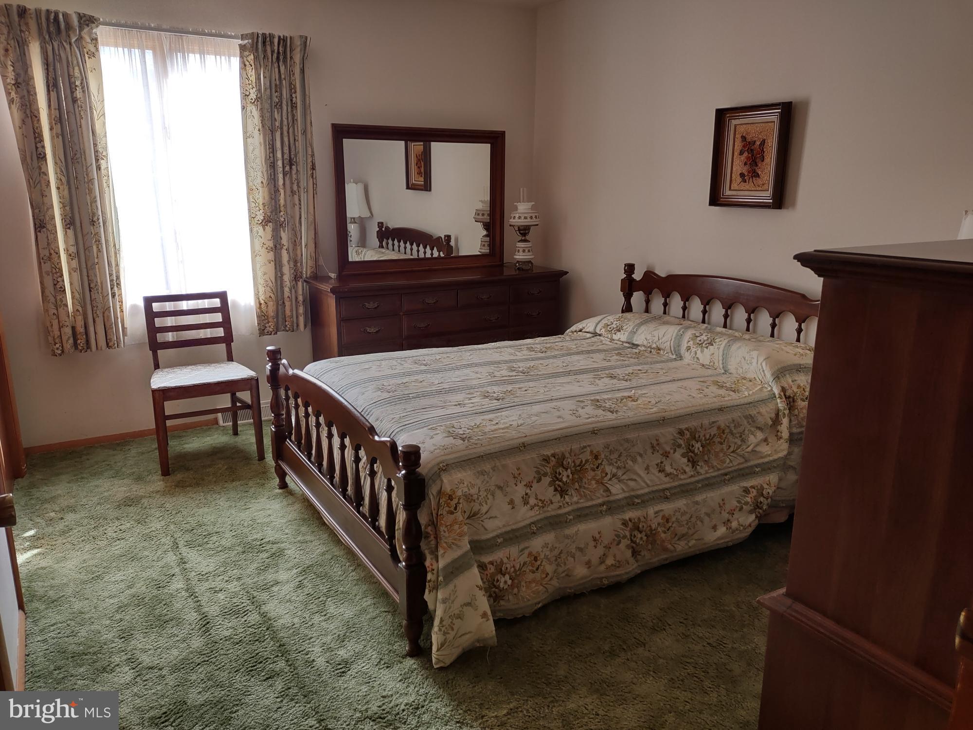 601 Rowe Drive Aberdeen, MD 21001 - Photo 34 of 52 a bedroom with a bed and a dresser