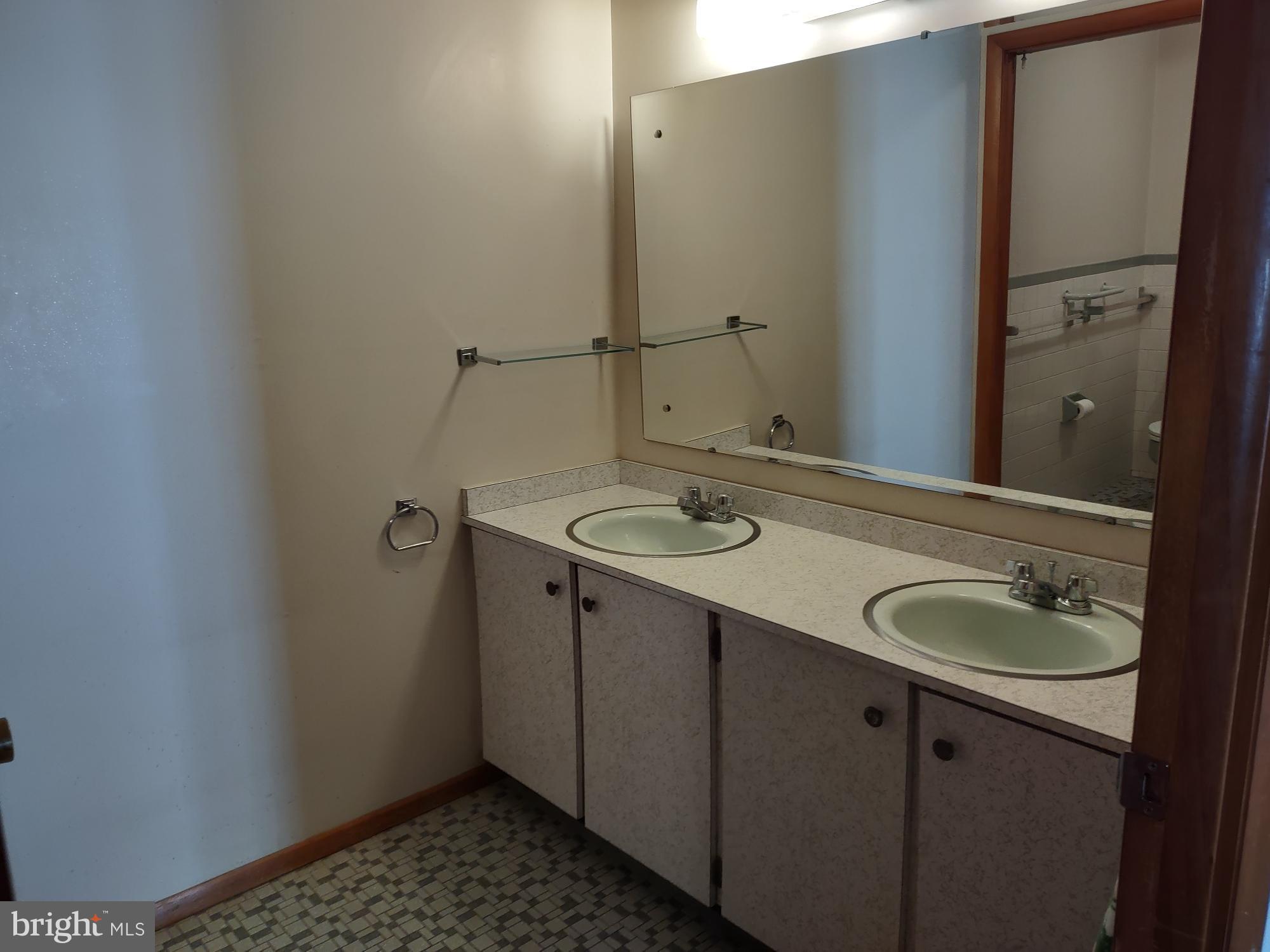 601 Rowe Drive Aberdeen, MD 21001 - Photo 41 of 52 a bathroom with a sink and a mirror