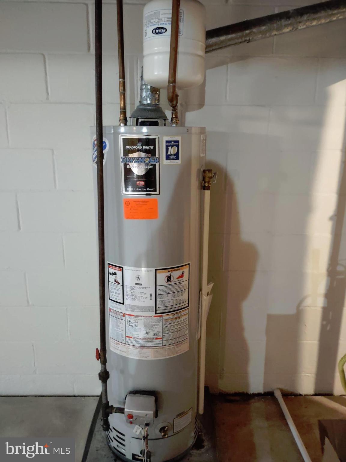 601 Rowe Drive Aberdeen, MD 21001 - Photo 50 of 52 a room with water heater and utility racks