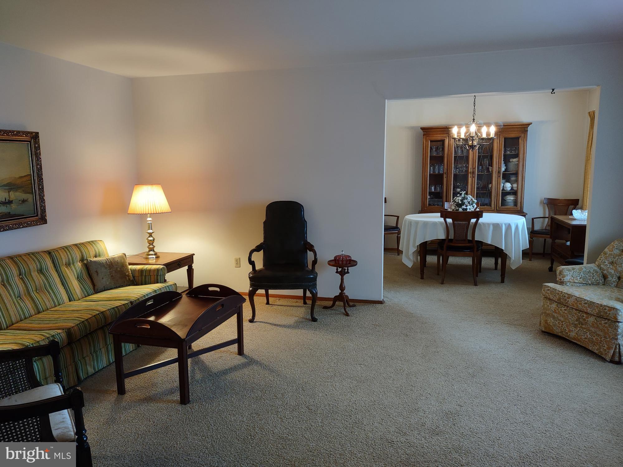 601 Rowe Drive Aberdeen, MD 21001 - Photo 10 of 52 a living room with furniture and a chandelier