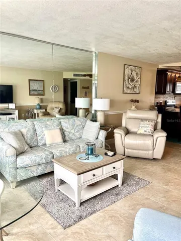 a living room with furniture and a couch