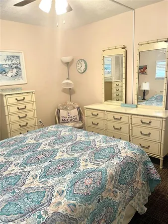a bedroom with a bed and a cabinets