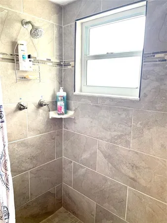 a bathroom with a sink and a shower