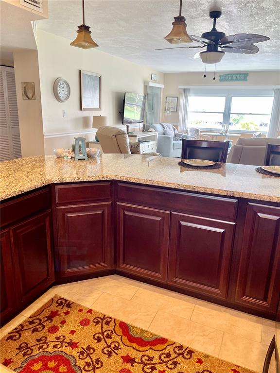 4650 Cove Circle, Unit 402 St. Petersburg, FL 33708 - Photo 9 of 36 a bathroom with a sink and a mirror
