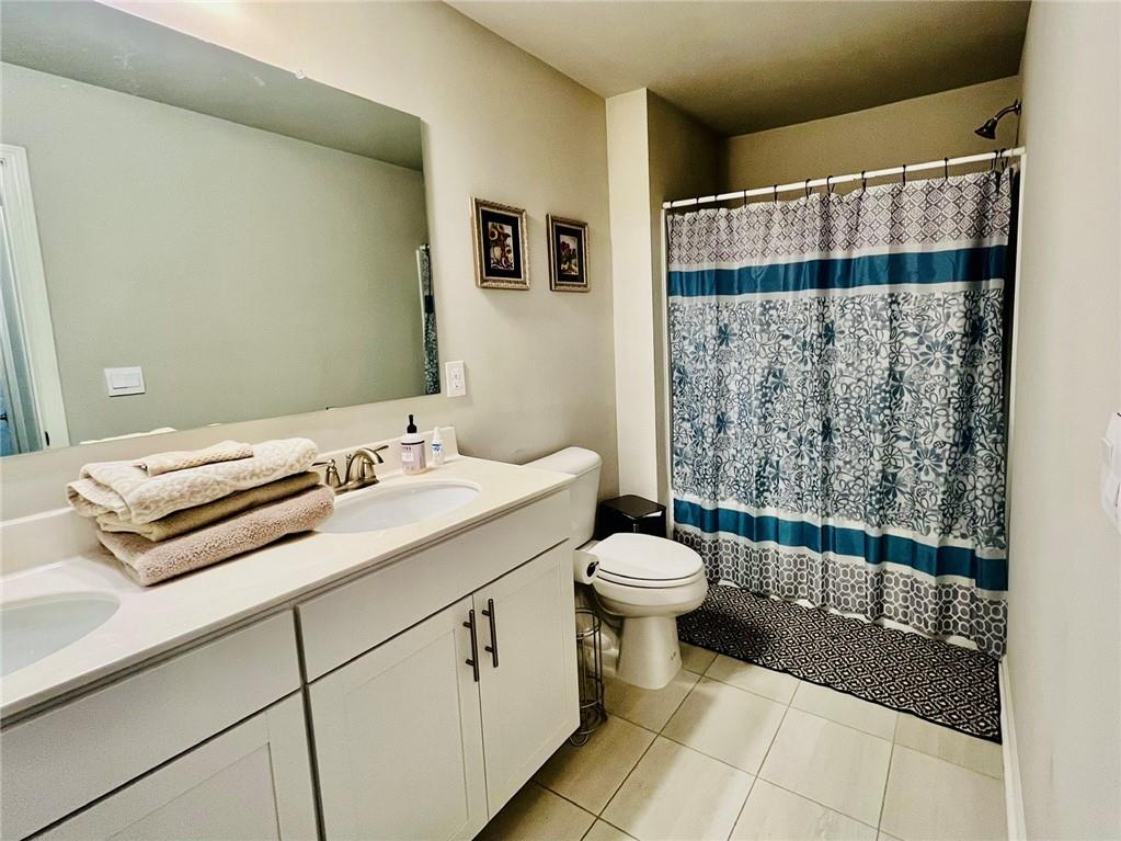 3015 Winding Ridge Waleska, GA 30183 - Photo 36 of 40 a bathroom with a sink toilet and shower