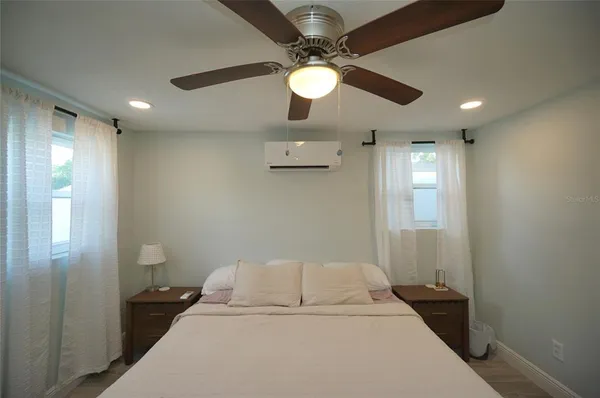 a bed room with a bed and a light fixture