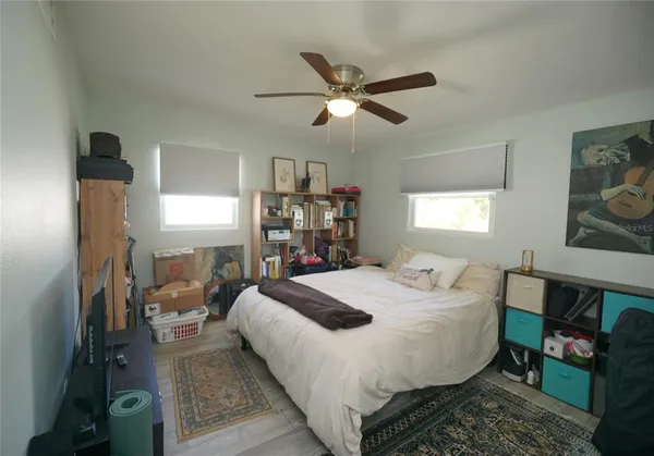 a bed room with a bed and a window