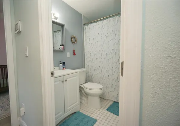 a bathroom with a sink and toilet