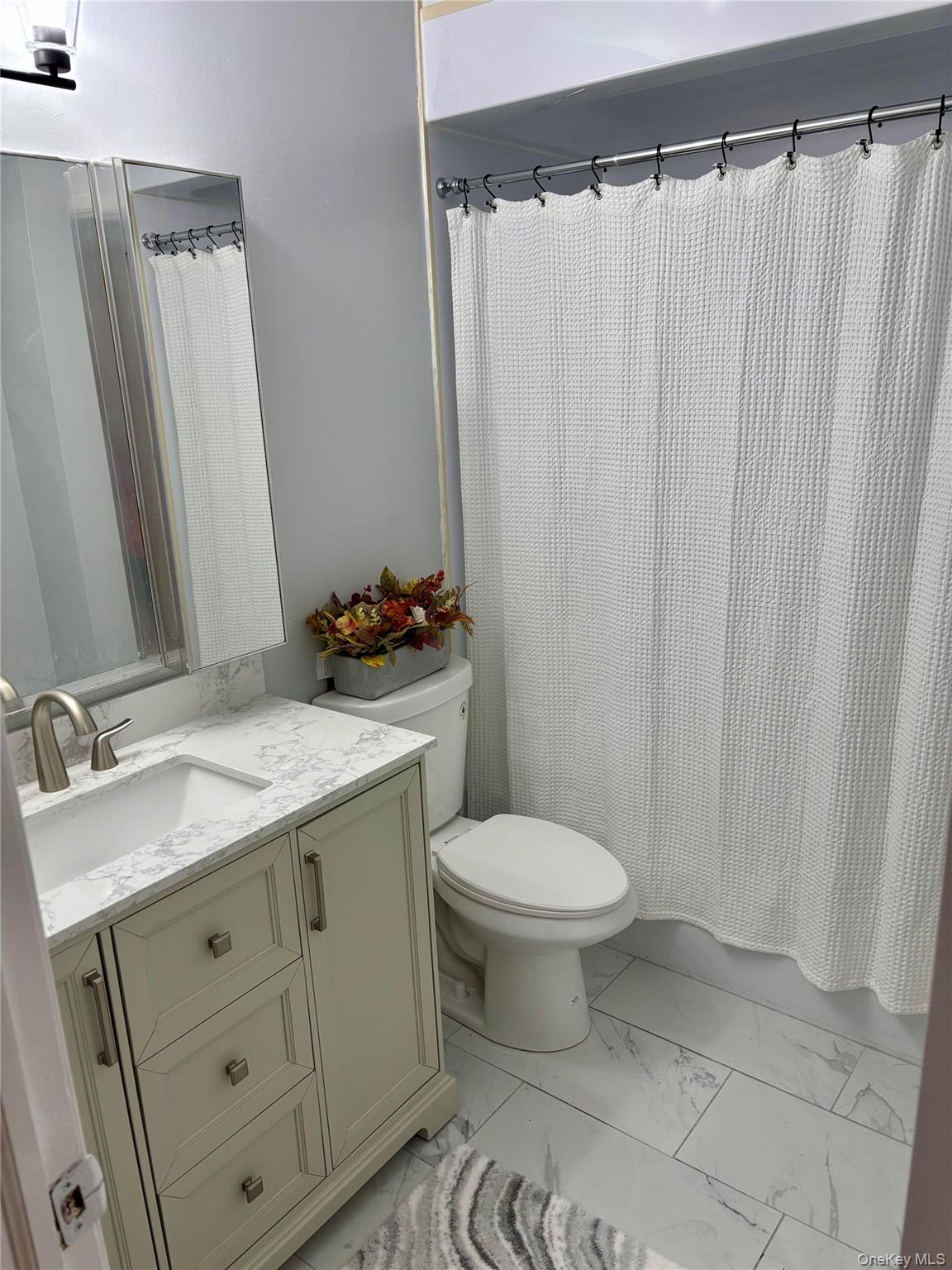 1483 4th Street West Babylon, NY 11704 - Photo 9 of 25 a bathroom with a granite countertop sink toilet and shower