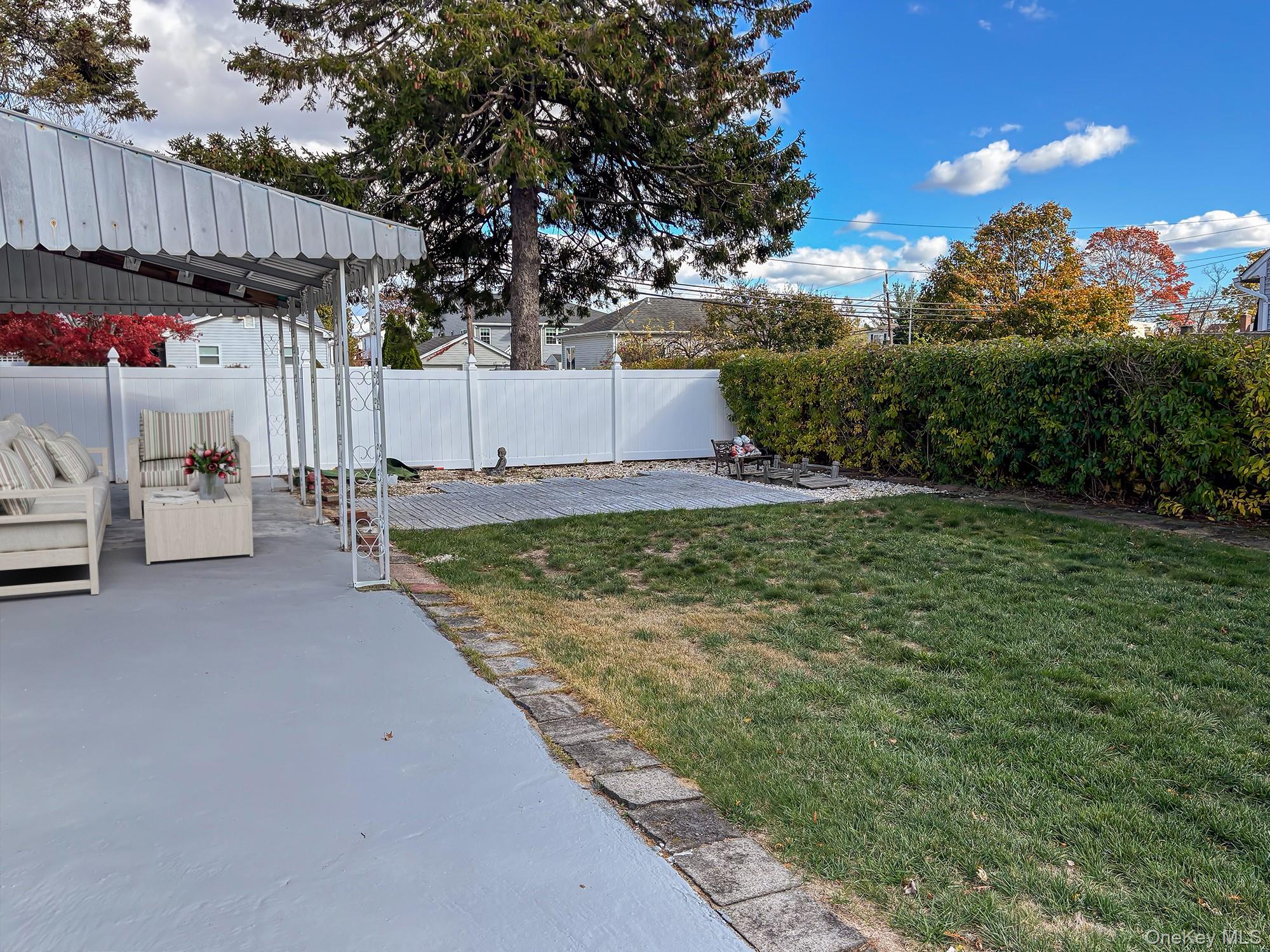 1483 4th Street West Babylon, NY 11704 - Photo 22 of 25 a view of a backyard