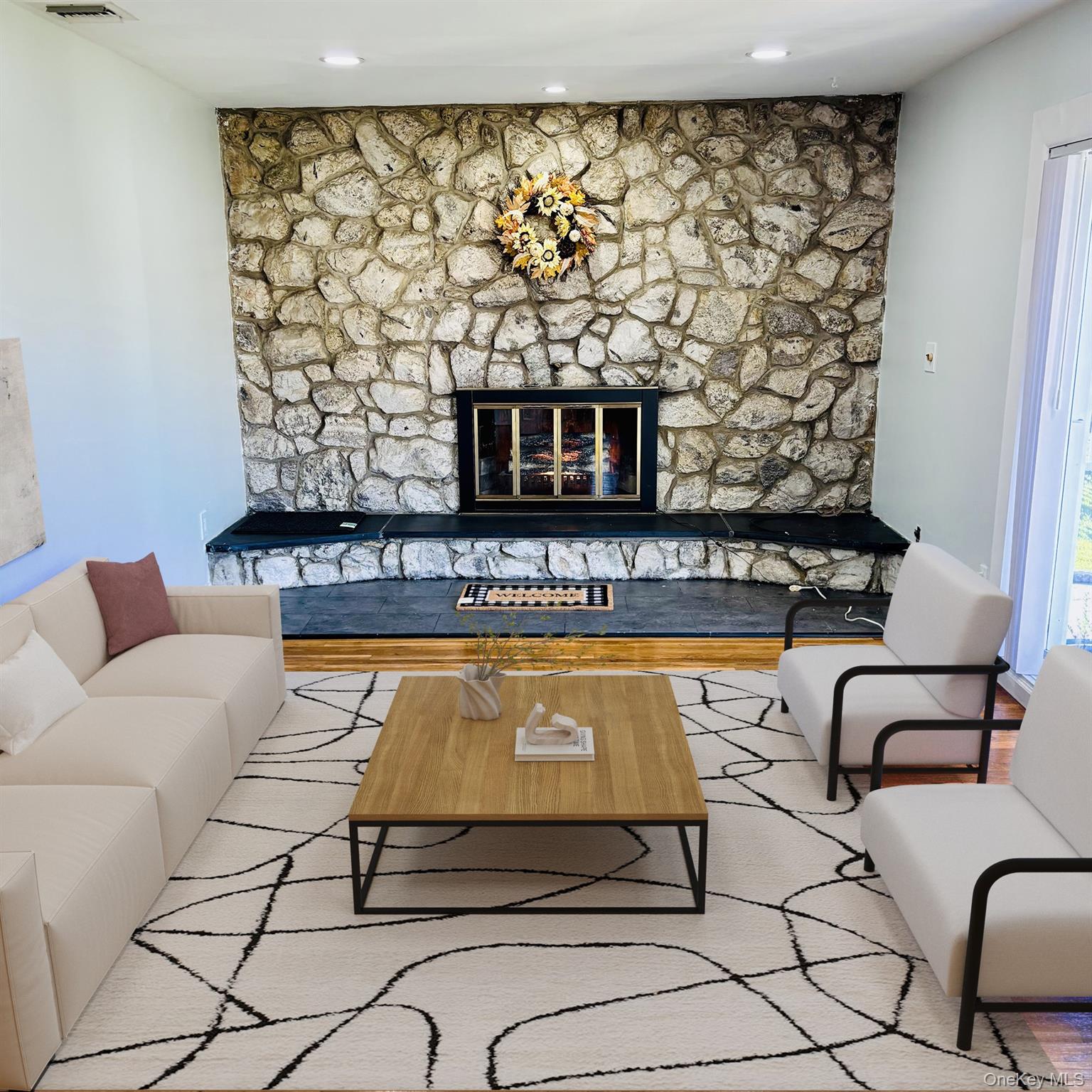 1483 4th Street West Babylon, NY 11704 - Photo 3 of 25 a living room with furniture and a fireplace