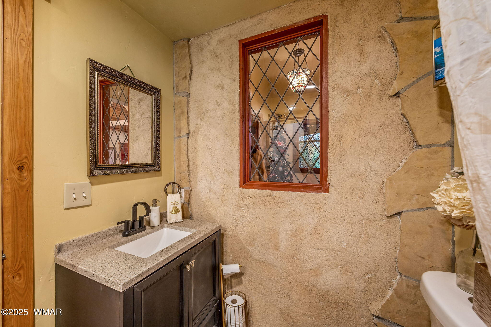 2891 Antelope Trail Overgaard, AZ 85933 - Photo 20 of 41 a bathroom with a granite countertop sink mirror and toilet