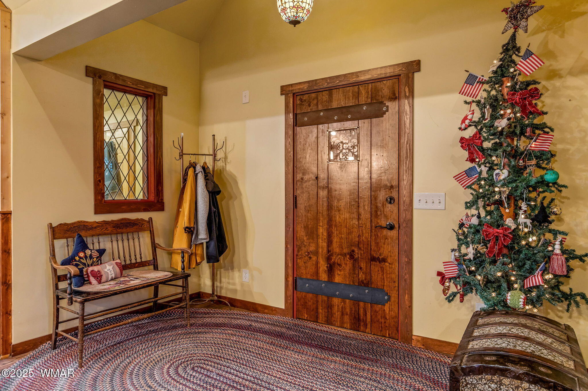2891 Antelope Trail Overgaard, AZ 85933 - Photo 3 of 41 a view of a hallway with wooden floor and a potted plant