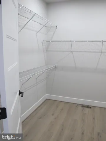 an aerial view of a house with garden space and lake view