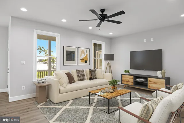 an aerial view of ocean with residential house with outdoor space and trees around