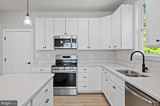 a bathroom with a sink vanity and a mirror