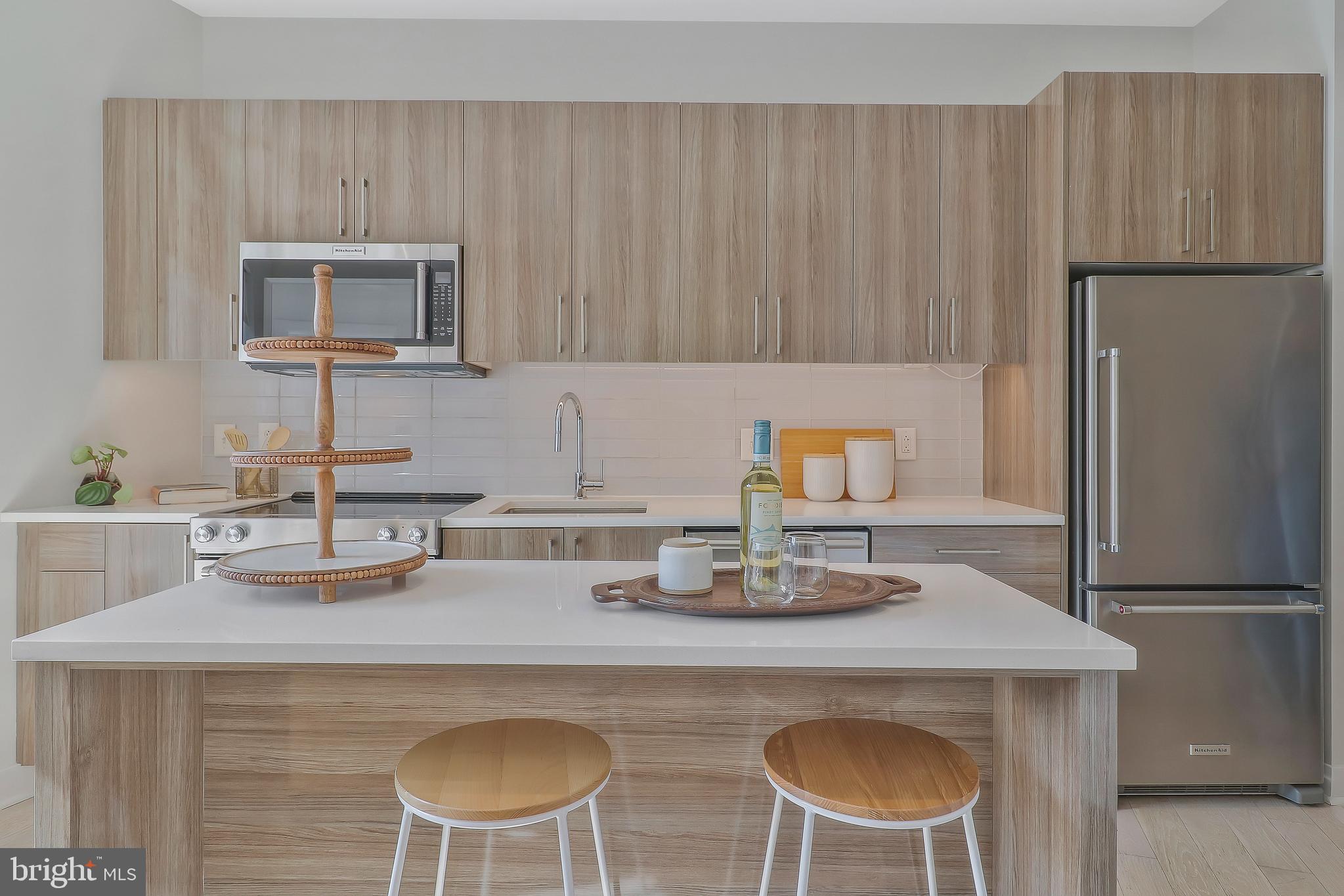 1794 Lanier Place Northwest, Unit 309 Washington, DC 20009 - Photo 4 of 22 Kitchen with bar seating
