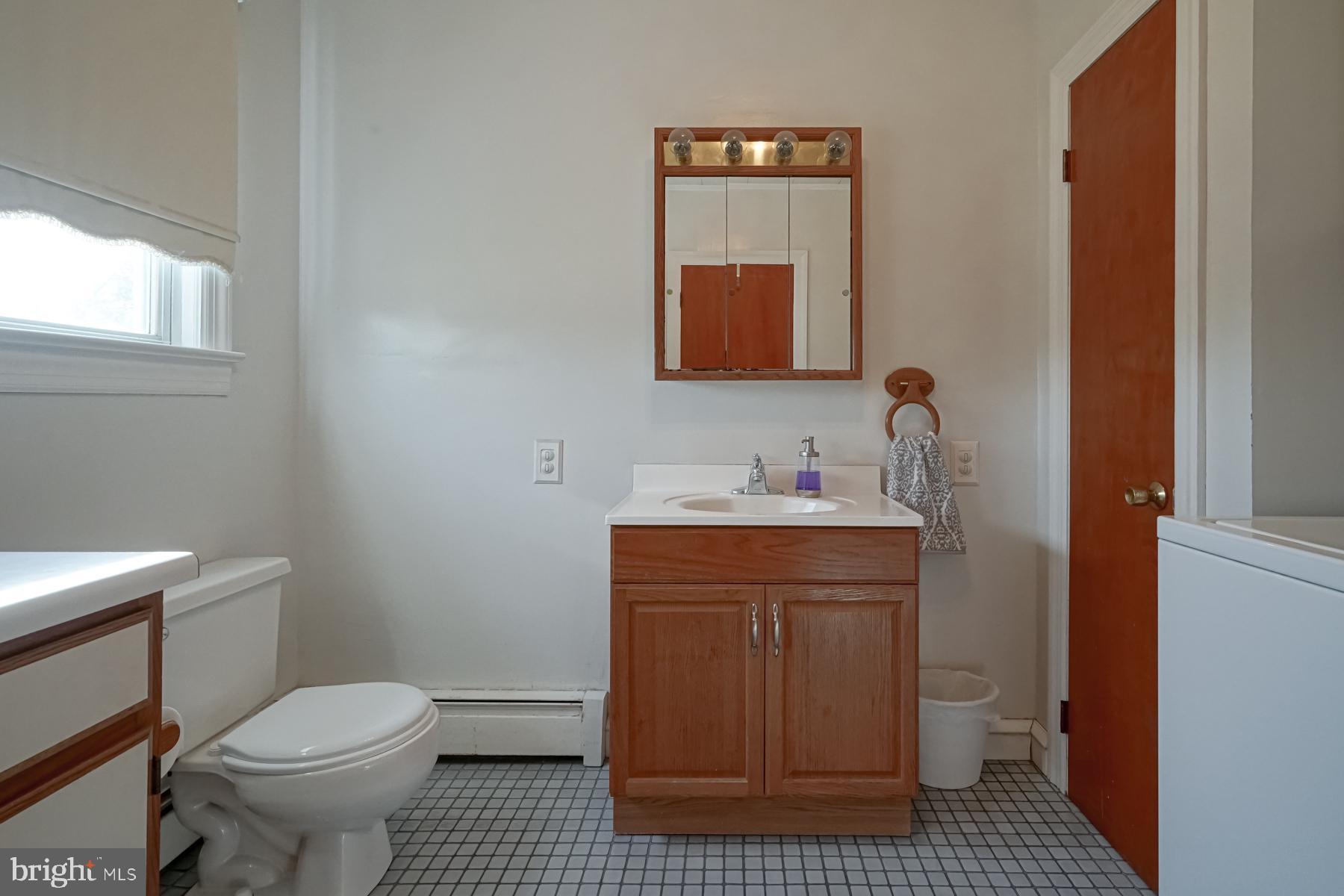 124 North 1st Road Hammonton, NJ 08037 - Photo 18 of 29 a bathroom with a toilet a sink and mirror