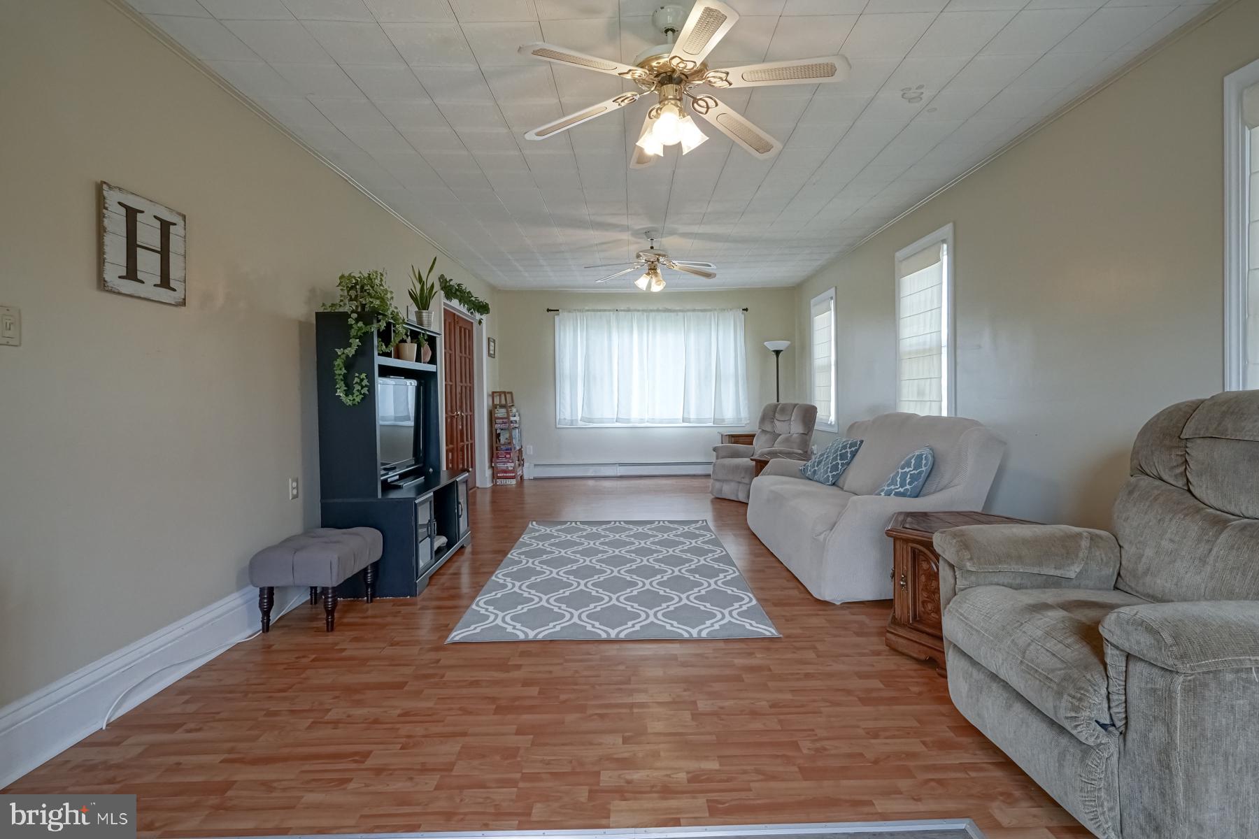 124 North 1st Road Hammonton, NJ 08037 - Photo 19 of 29 a living room with furniture and a rug