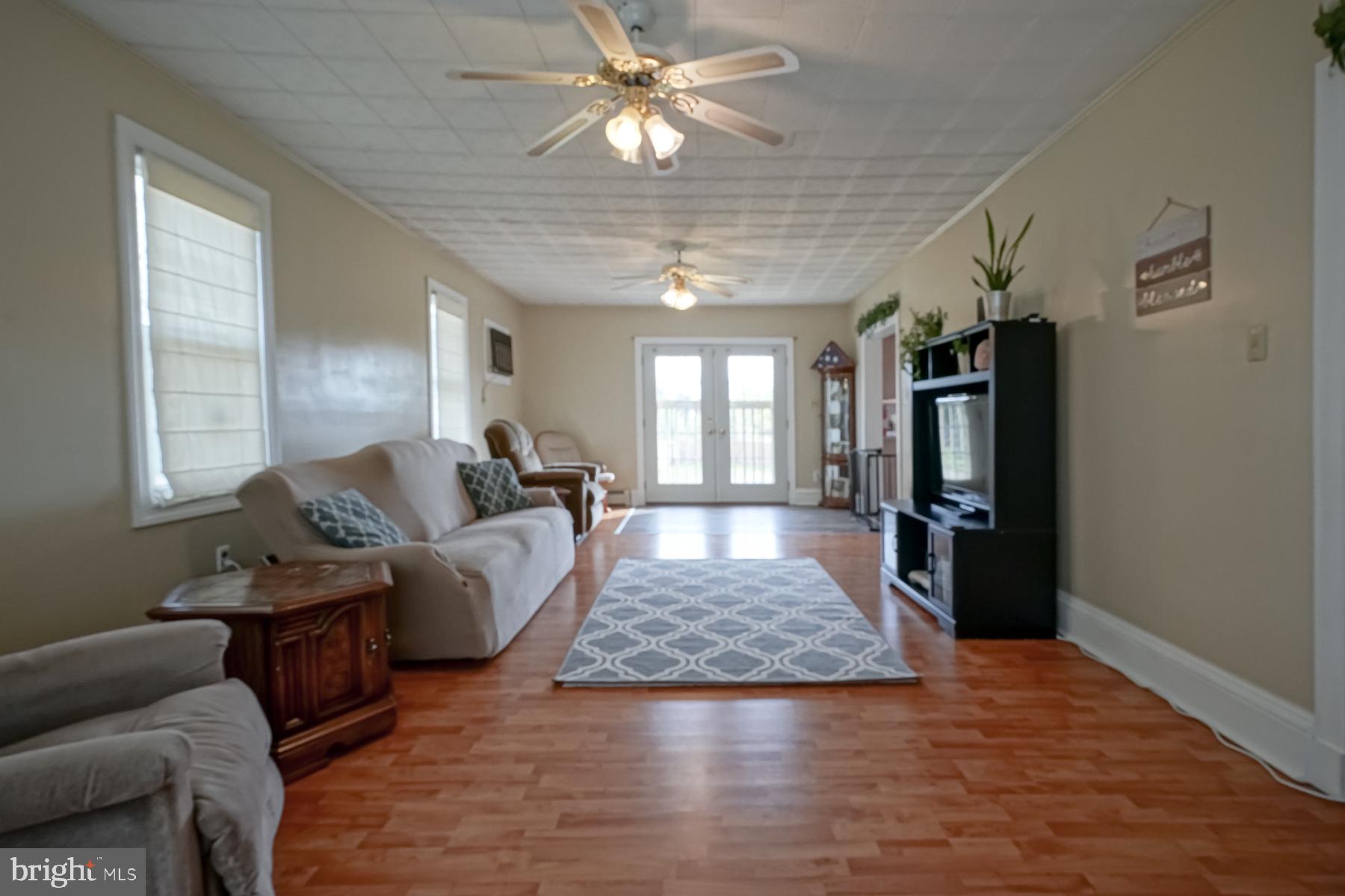 124 North 1st Road Hammonton, NJ 08037 - Photo 20 of 29 a living room with furniture and a chandelier