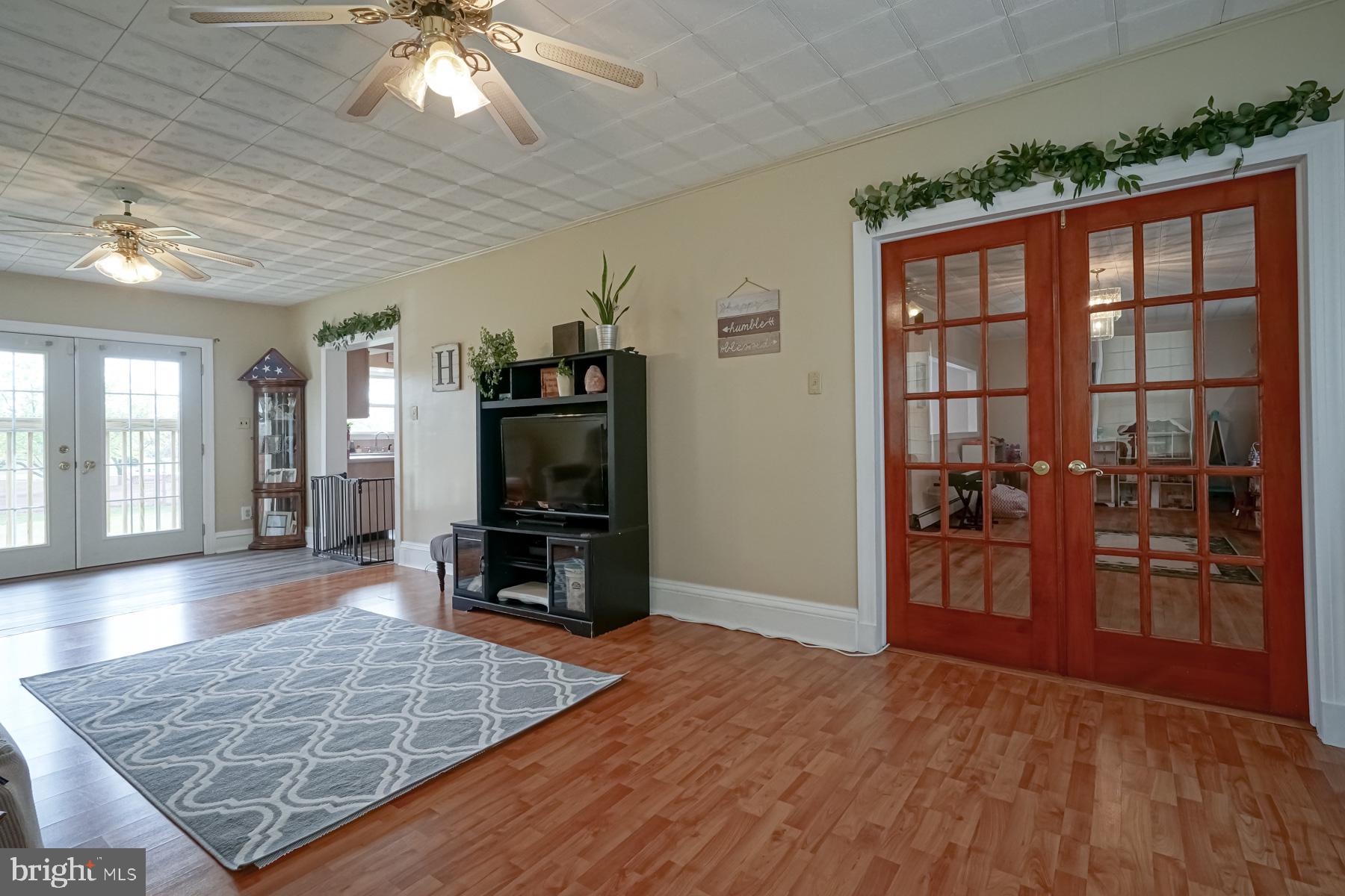 124 North 1st Road Hammonton, NJ 08037 - Photo 21 of 29 a living room with furniture and a flat screen tv