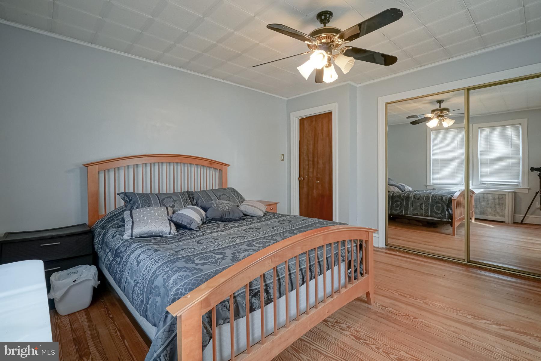 124 North 1st Road Hammonton, NJ 08037 - Photo 26 of 29 a bedroom with a bed and a chandelier