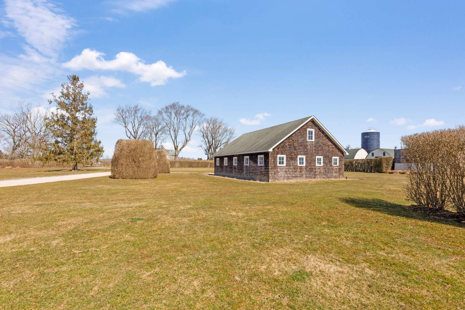 849 Hayground Road Water Mill, NY 11976 - Photo 20 of 31 a front view of a house with a yard