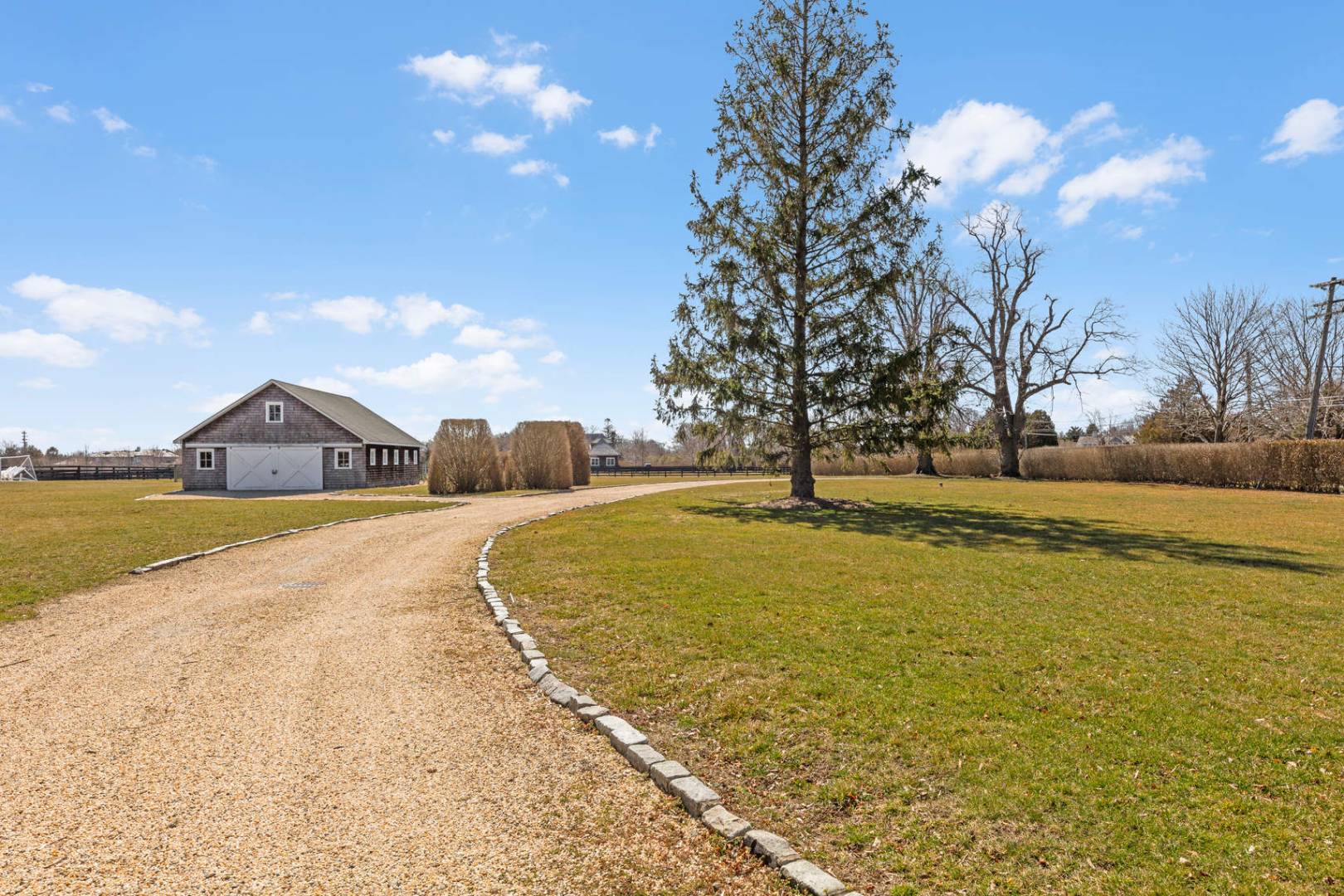 849 Hayground Road Water Mill, NY 11976 - Photo 9 of 31 a house view with swimming pool in front of it