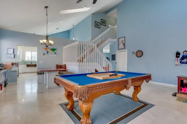 a dining room with a table and chairs