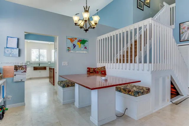 a room with furniture and chandelier