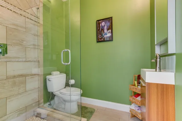 a bathroom with a toilet and a sink