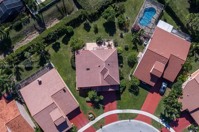 an aerial view of house with yard