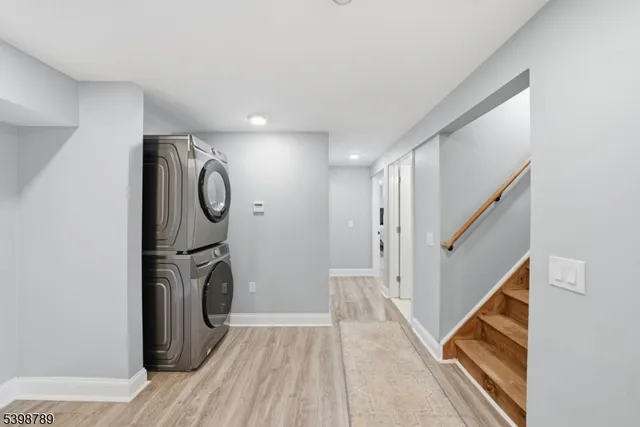 a view of a hallway with washer and dryer