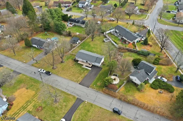 a yellow house with trees in front of it