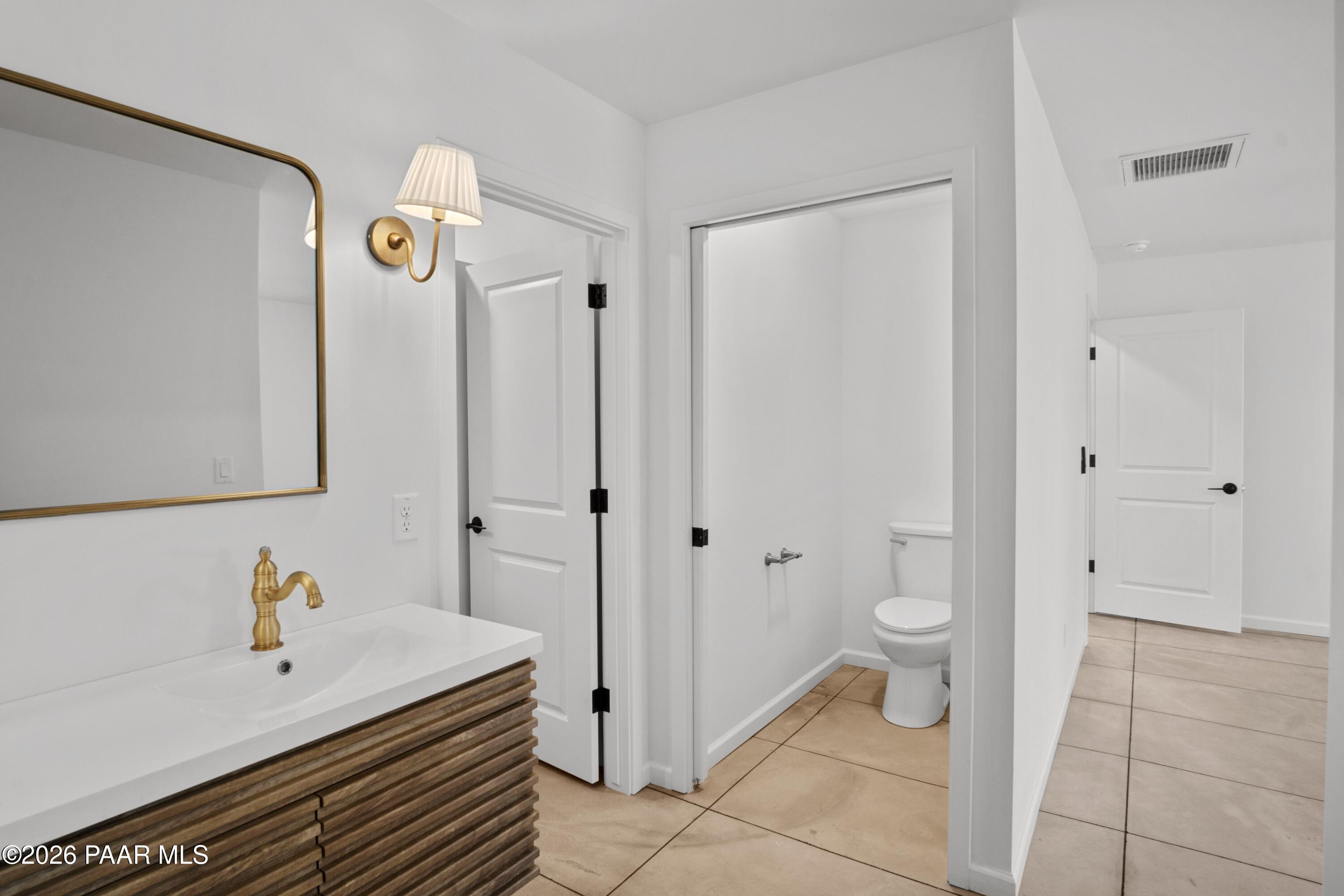 4920 East Amber Road Prescott, AZ 86301 - Photo 21 of 38 a bathroom with a sink toilet and shower