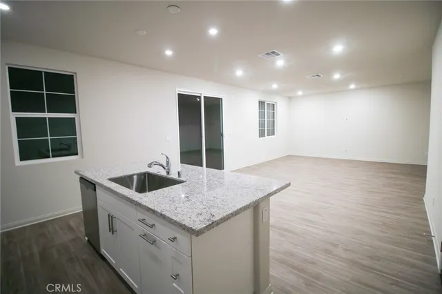 a kitchen with sink and microwave