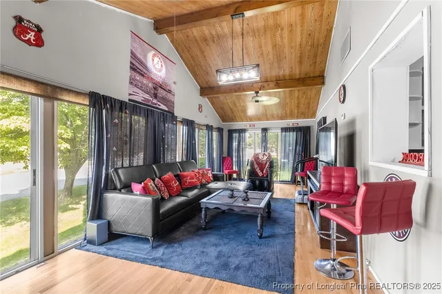 a living room with furniture or couch and a large window