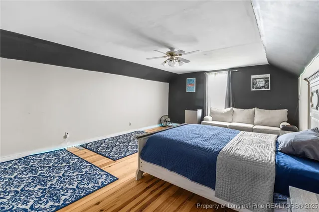 a bedroom with bed and a window