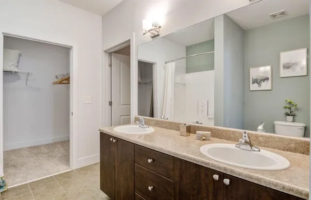 a bathroom with a sink vanity and mirror