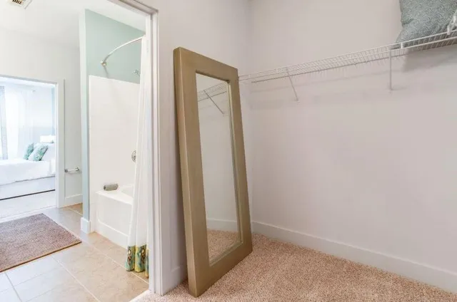 a kitchen with kitchen island granite countertop a refrigerator stove top oven and sink
