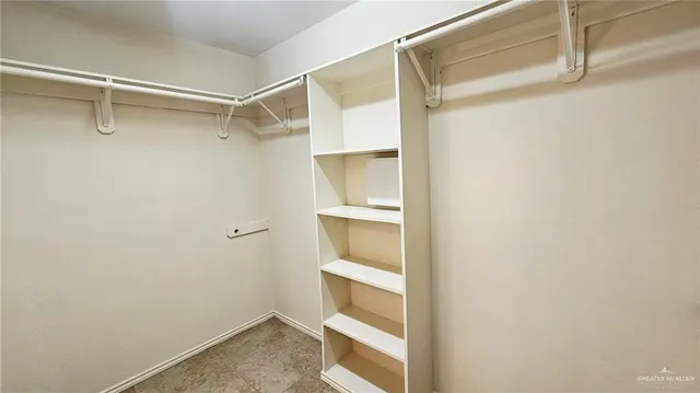 a view of an empty walk in closet