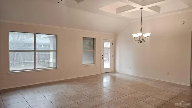 a view of a room with windows and chandelier
