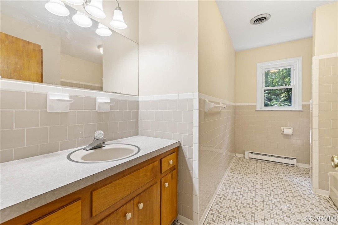 4200 Esposito Place Prince George, VA 23875 - Photo 13 of 29 Full bathroom with a baseboard radiator, tile wall